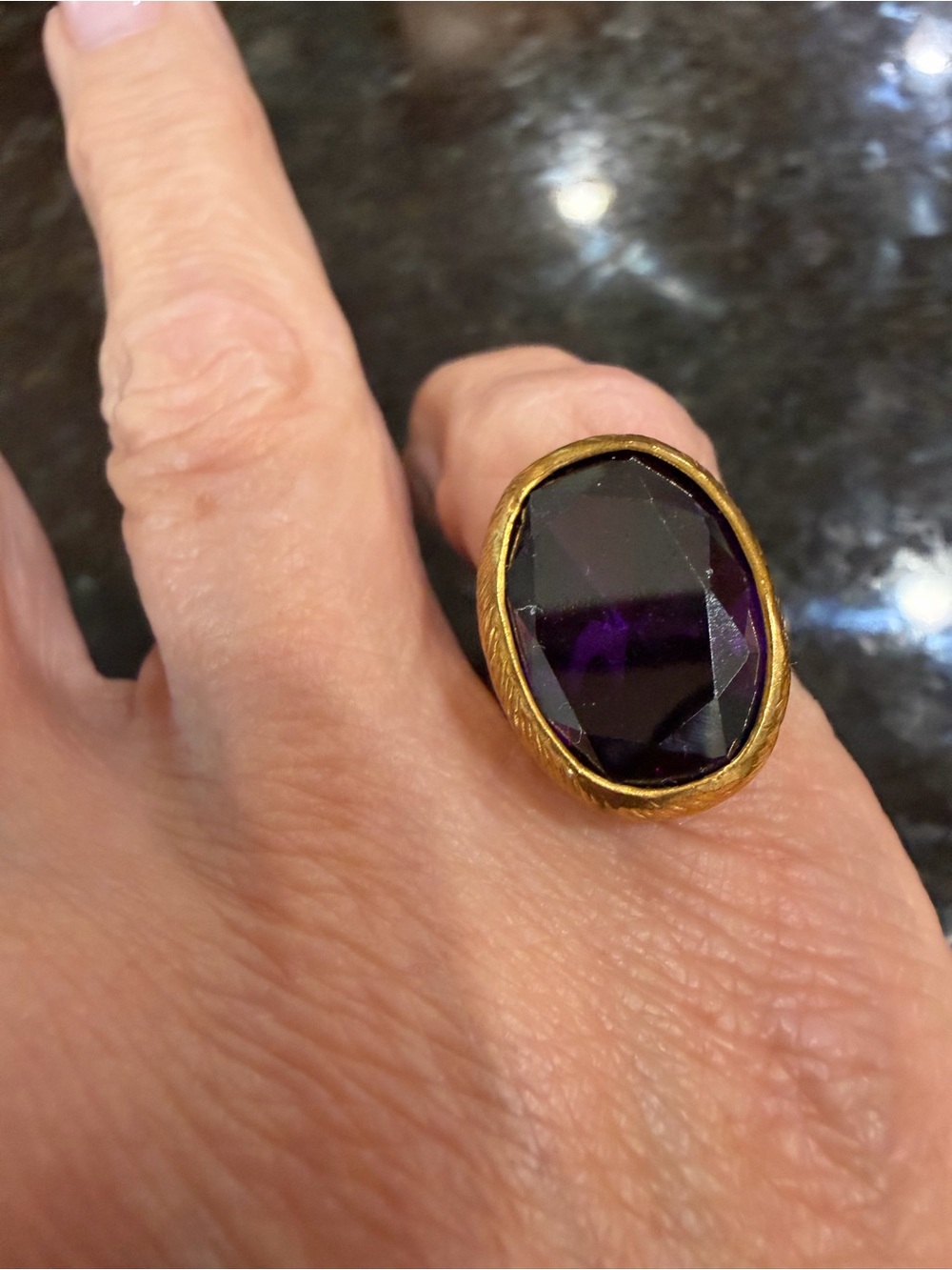 Gold-Tone Ring with Deep Amethyst Faceted Stone
